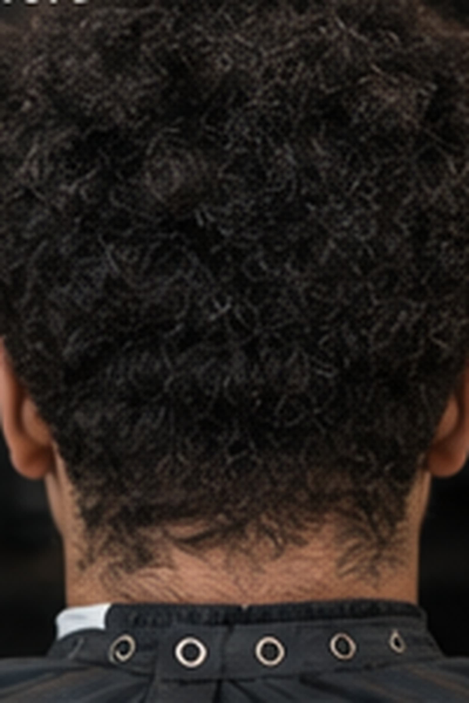 The same client before, with an uneven grown-out taper